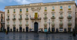 View of the historic university building in Catania, Sicily, showcasing neoclassical architecture.